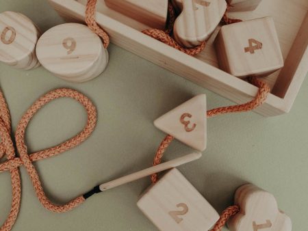 Wooden lacing toy with numbers and geometry shapes Online